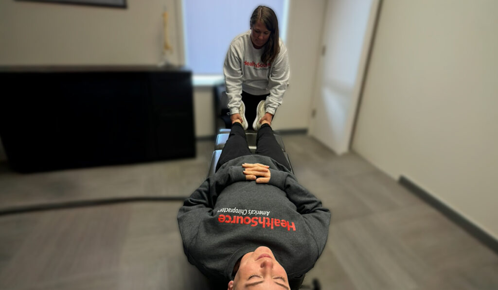 Dr. Kari Schmidt adjusting a chiropractic patient at HealthSource of Downtown Mokena.
