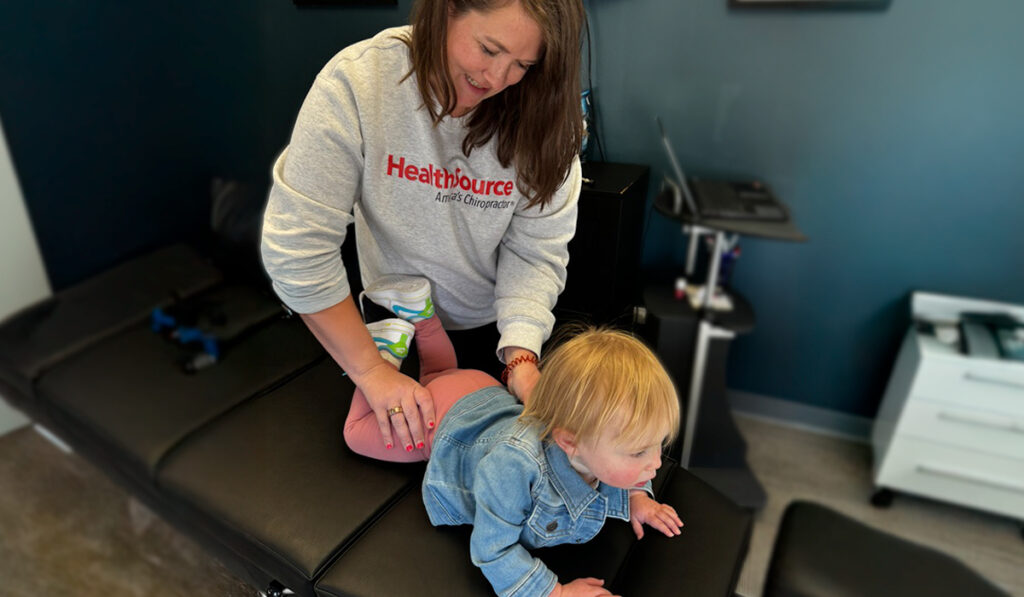 Dr. Kari Schmidt, adjusting a pediatric patient at HealthSource of Downtown Mokena.