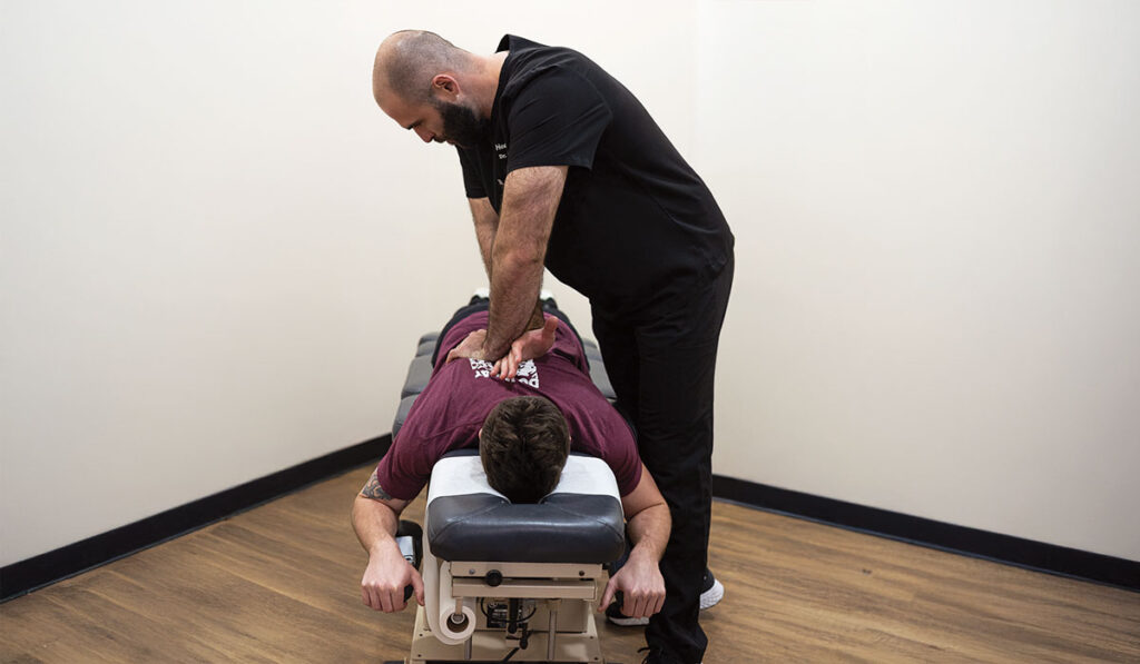 Patient receiving a chiropractic adjustment at HealthSource of Spanish Fort.