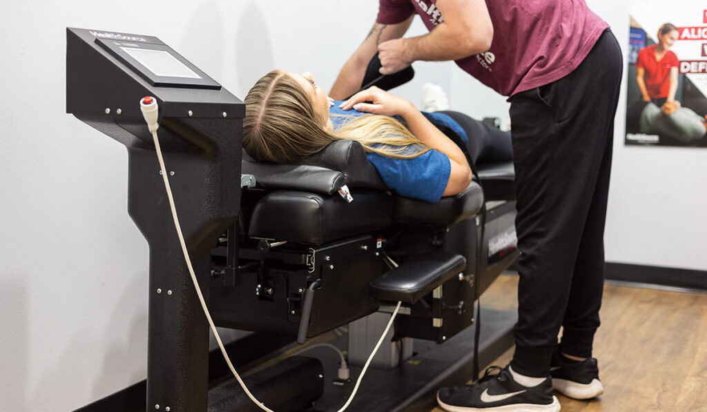 A patient receiving Spinal Decompression Therapy at HealthSource of Spanish Fort.