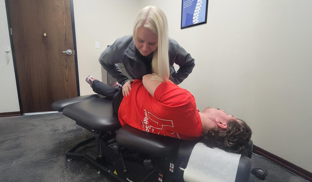 Dr. Fussy performing a chiropractic adjustment on a patient at HealthSource of Mankato.