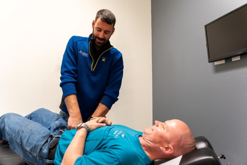 Dr. Robert Hennen, Doctor of Chiropractic, adjusting a patient at HealthSource of Marshall.