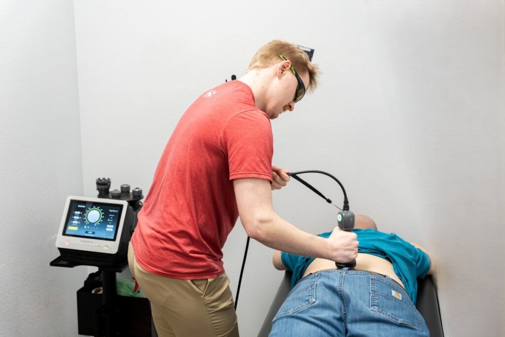 A patient receiving class IV laser therapy at HealthSource of Marshall.