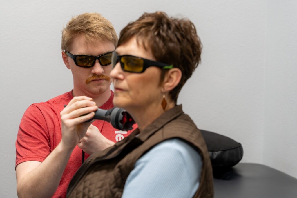 A patient receiving class IV laser therapy at HealthSource of Marshall.