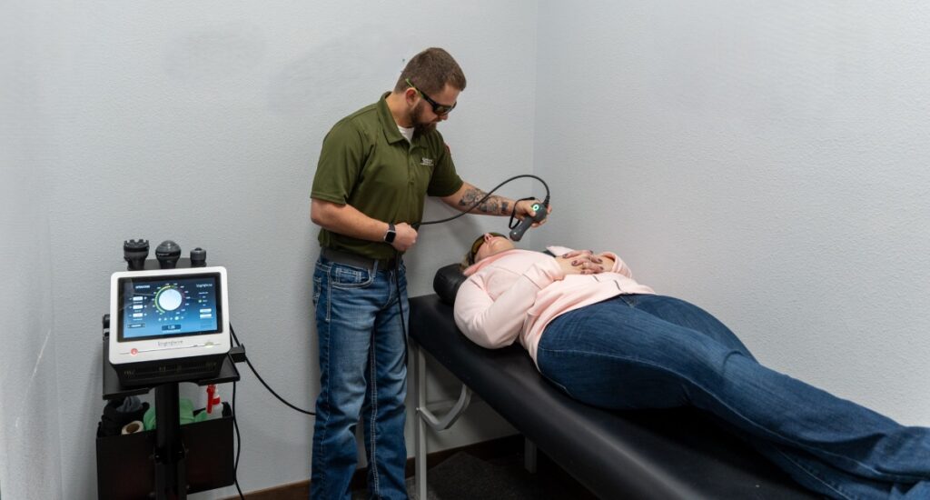 A patient receiving class IV laser therapy at HealthSource of Marshall.