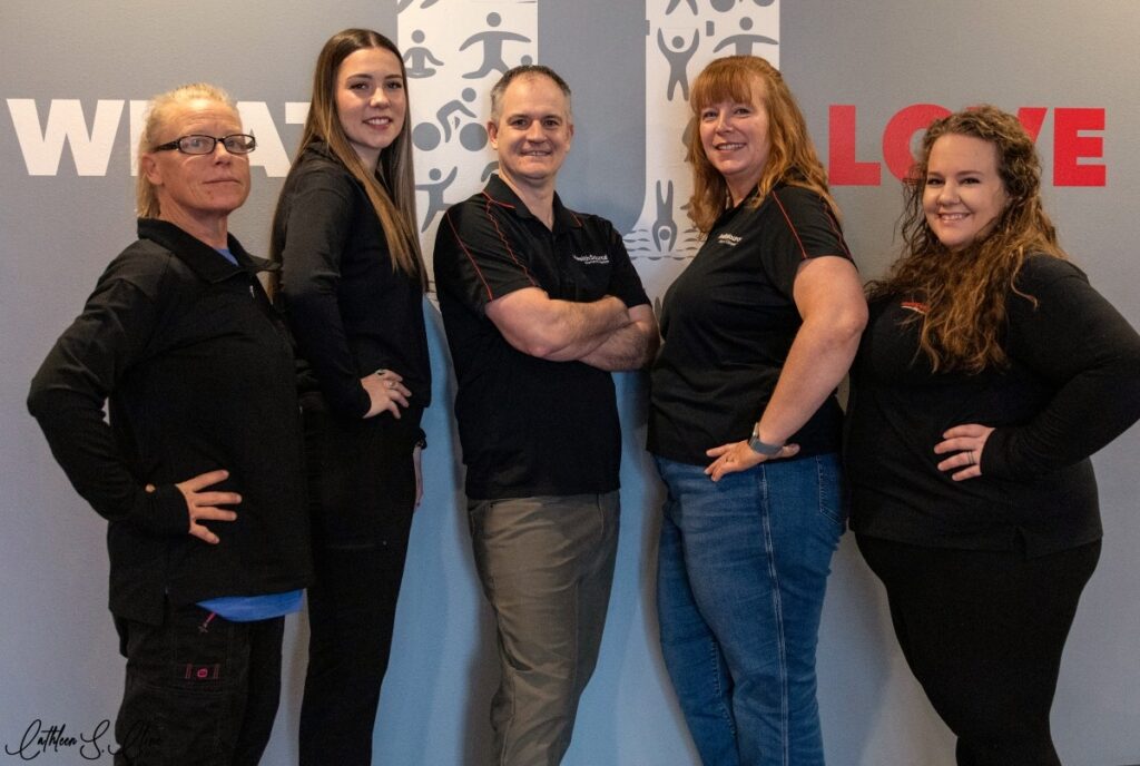 Dr. Faubion and the team at HealthSource of Riverton standing together inside the clinic.