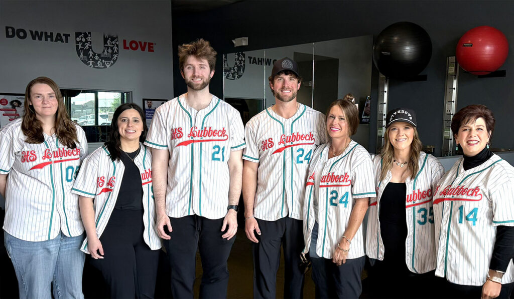 The team at HealthSource of Southwest Lubbock standing together inside the clinic.