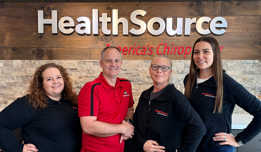 Dr. Faubion and the team at HealthSource of Riverton standing together inside the clinic.