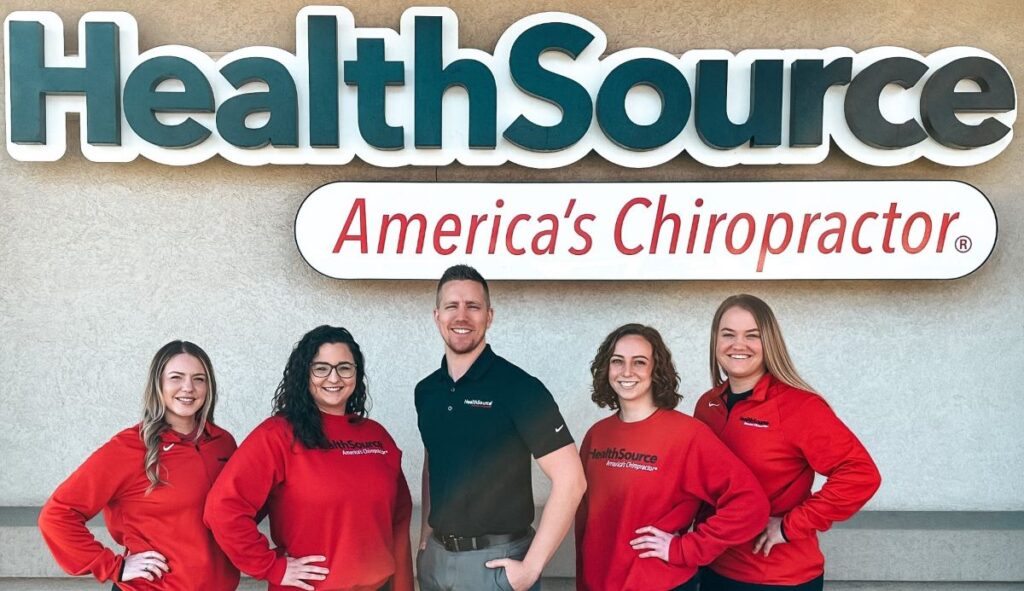 Dr. Kurt Slonaker and the HealthSource of Meridian team standing outside the clinic underneath the HealthSource sign.