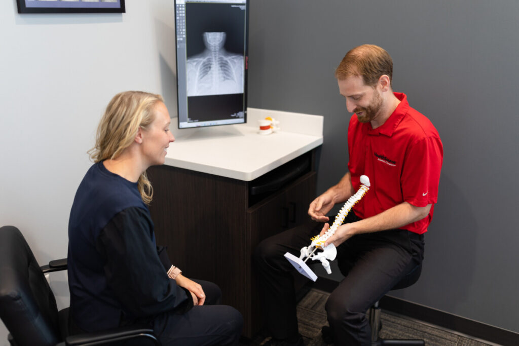 Dr. Tyler meeting with a patient during their report of findings exam.