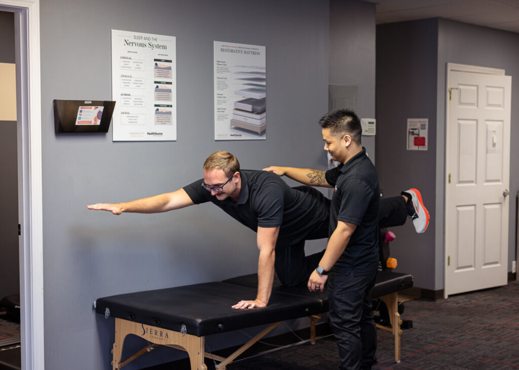Patient stretching with Rehabilitation Specialist.