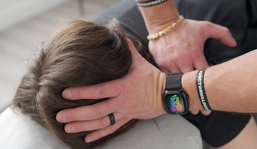 A patient receiving a chiropractic adjustment with Dr. Alex Waldeck, at HealthSource of Decatur.