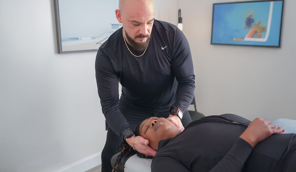 A patient receiving a chiropractic adjustment with Dr. Alex Waldeck, at HealthSource of Decatur.