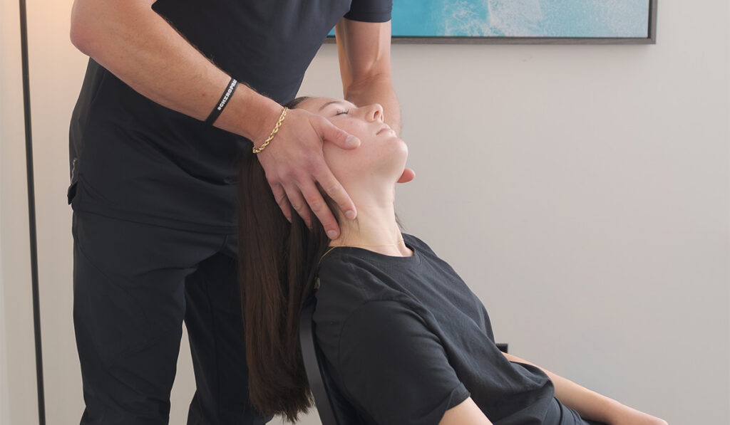 A patient receiving a chiropractic adjustment with Dr. Alex Waldeck, at HealthSource of Decatur.
