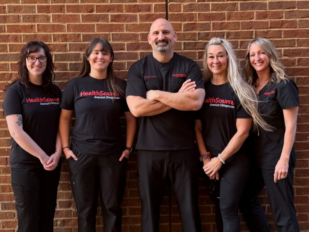 The team at HealthSource of Huntsville-Providence, posing together outside the clinic.