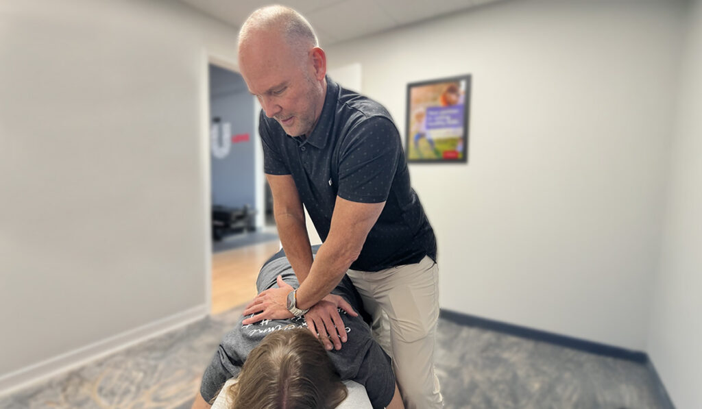Dr. Jeff Ashforth adjusting a Chiropractic patient at HealthSource of Indian Land.