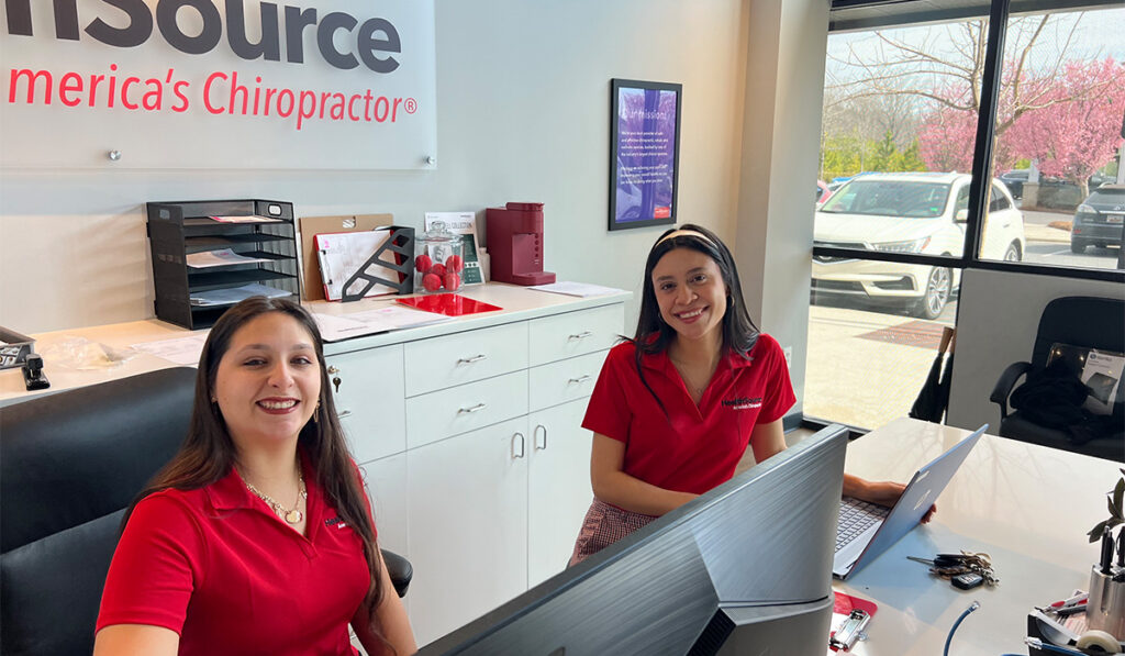 Dr. Joselyn Salmeron and the team sitting at the front desk at HealthSource of Indian Land.