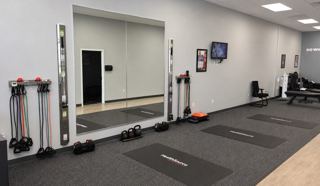 The Progressive Rehab area with floor mats, weights and exercise bands for patients to use at HealthSource of Burleson.