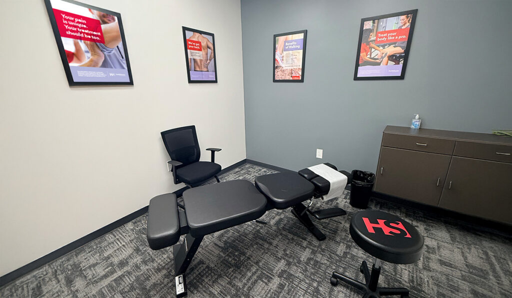 A chiropractic treatment room and adjustment table.