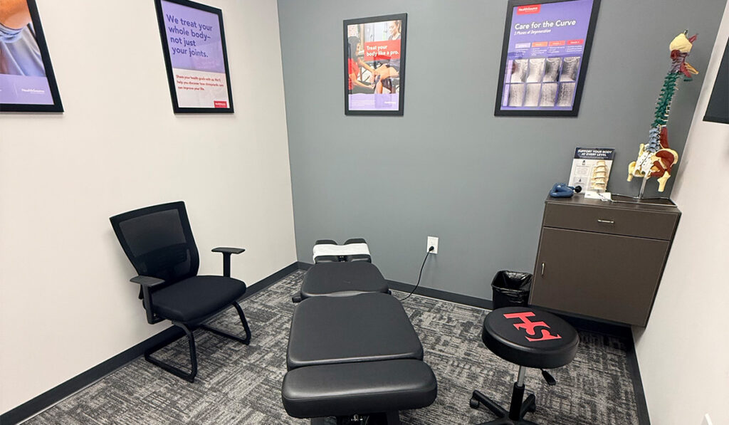 A chiropractic treatment room and adjustment table.